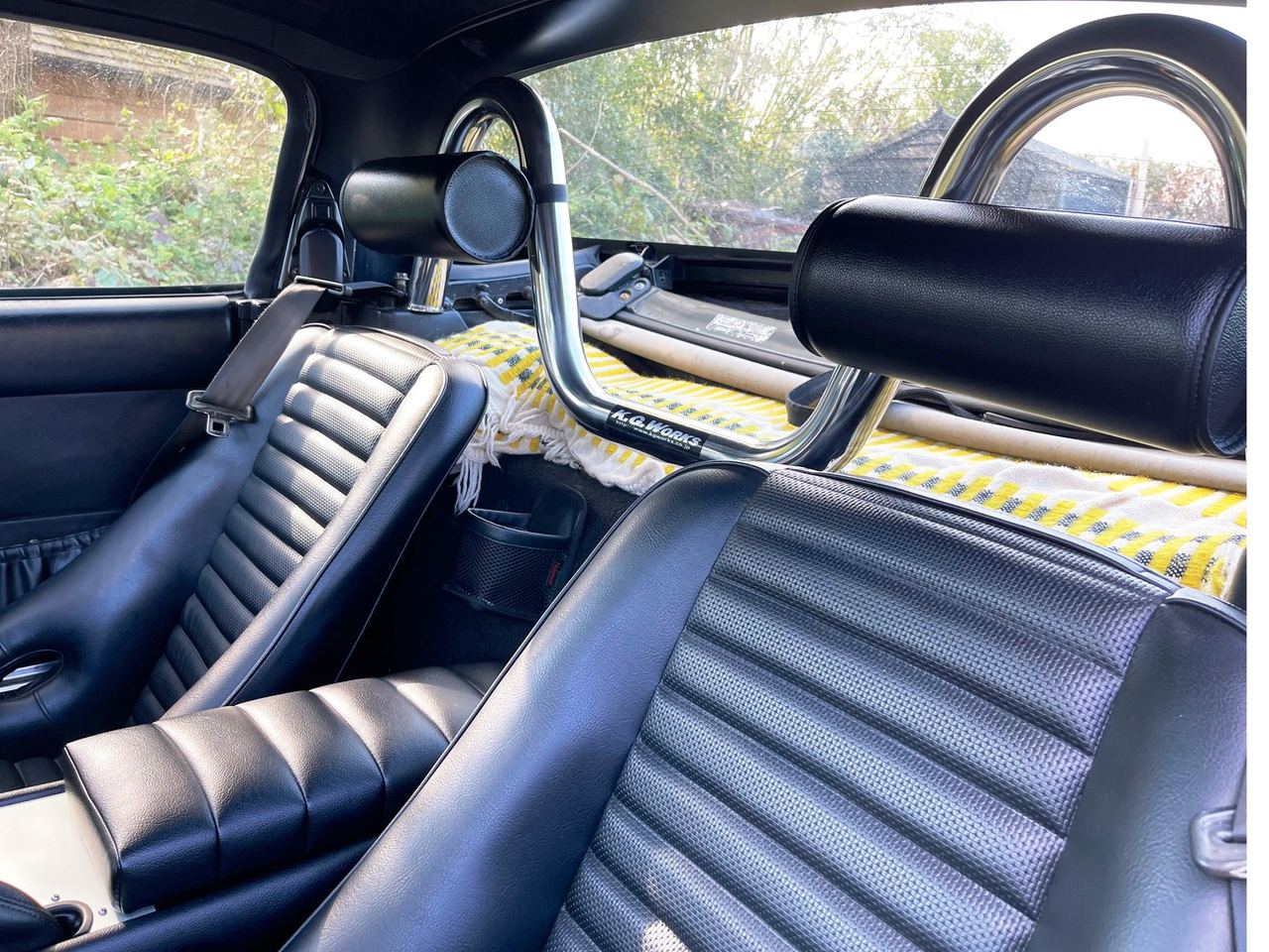 KGW style bar fitted. (Personally I like the low-back vintage style and don't miss the headrest. But my passen
