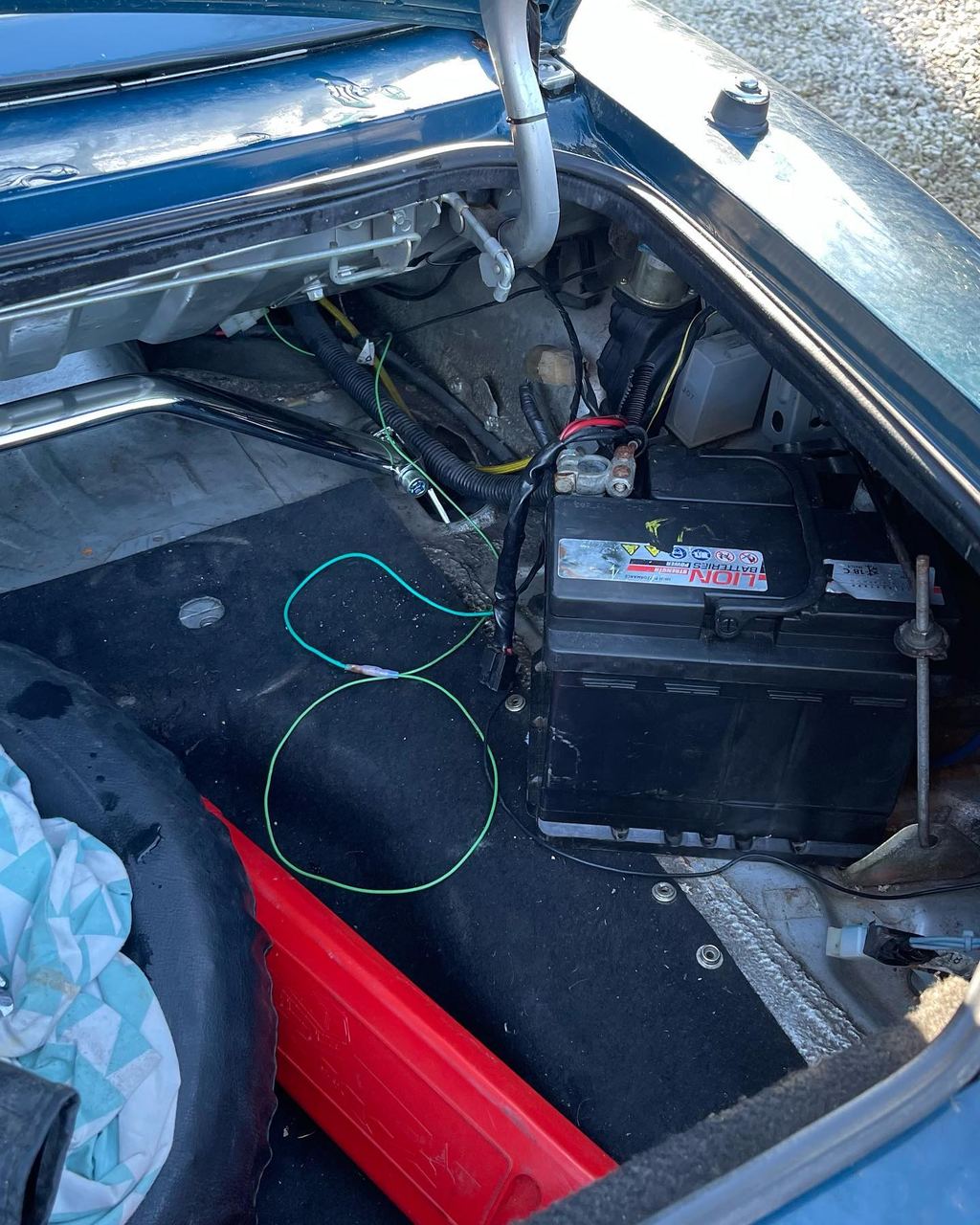 First time in an age where I've had time to work on the car. Swapping out the aged battery, new/resprayed hard